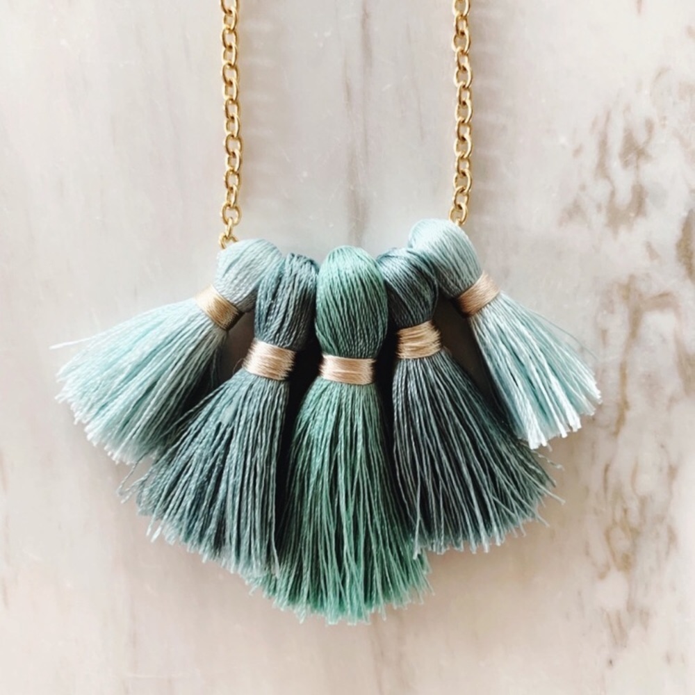 Brand new gold and seafoam tassel necklace